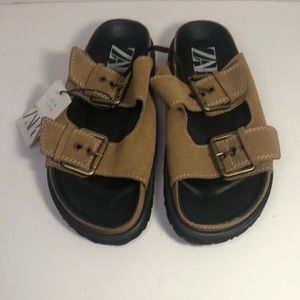 Buckled flat leather sandals